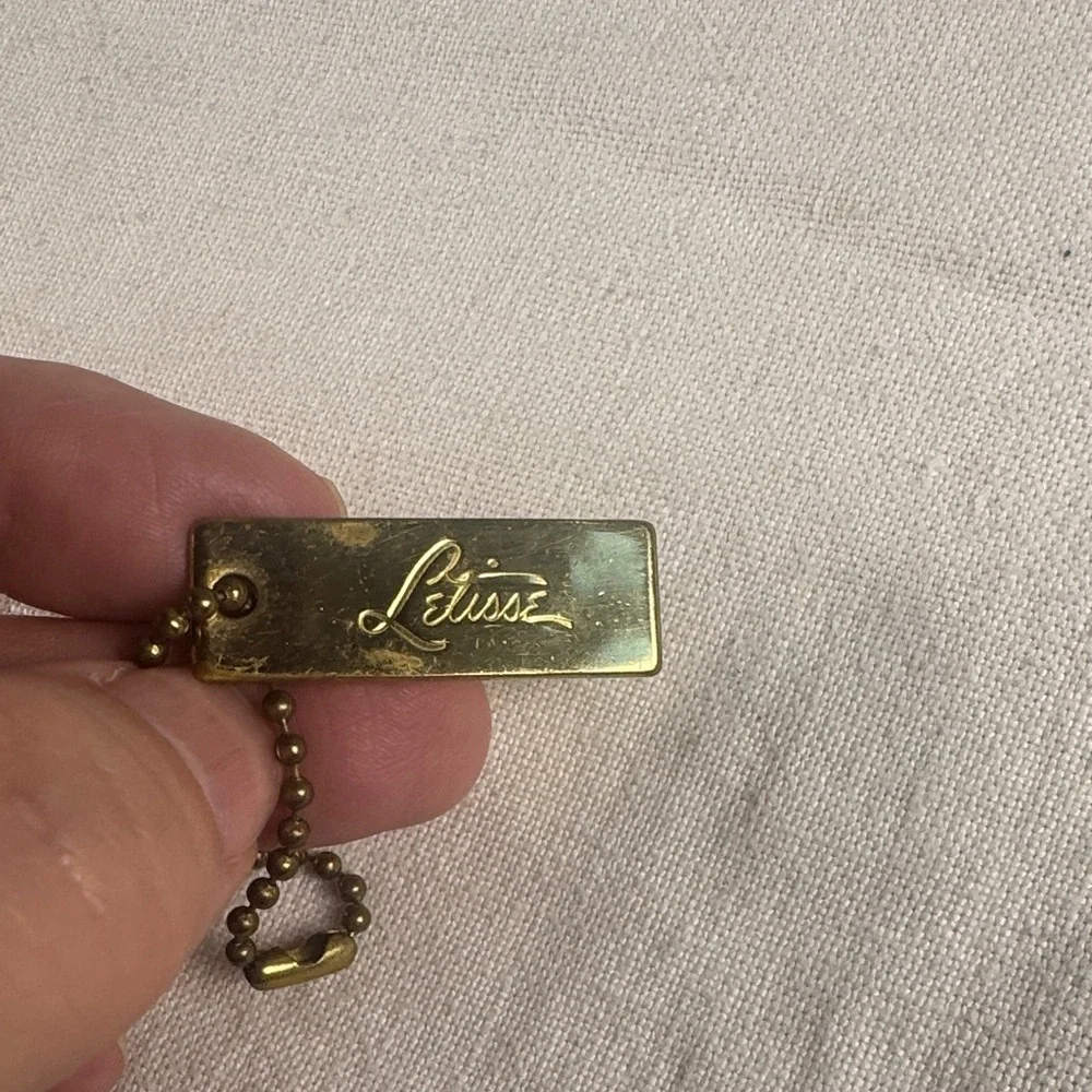 Letisse double sided gold bag charm tag